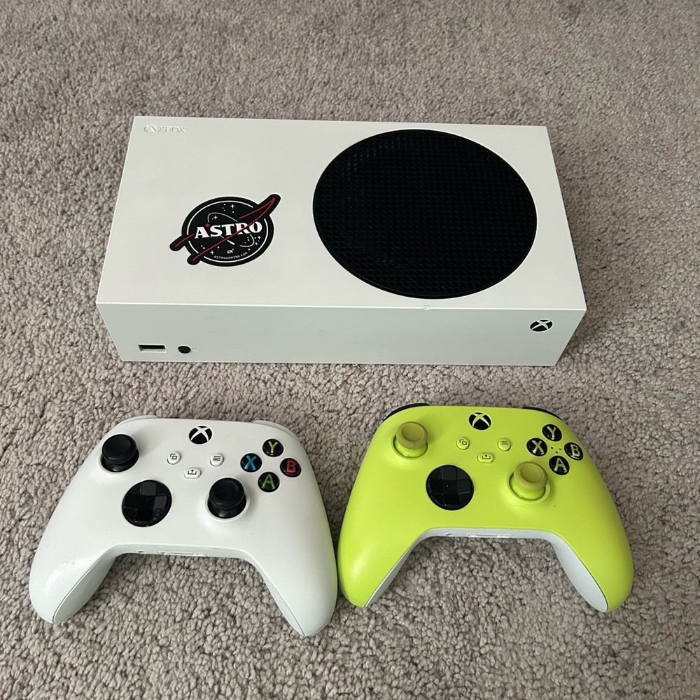 Xbox Console with White and Green Controllers